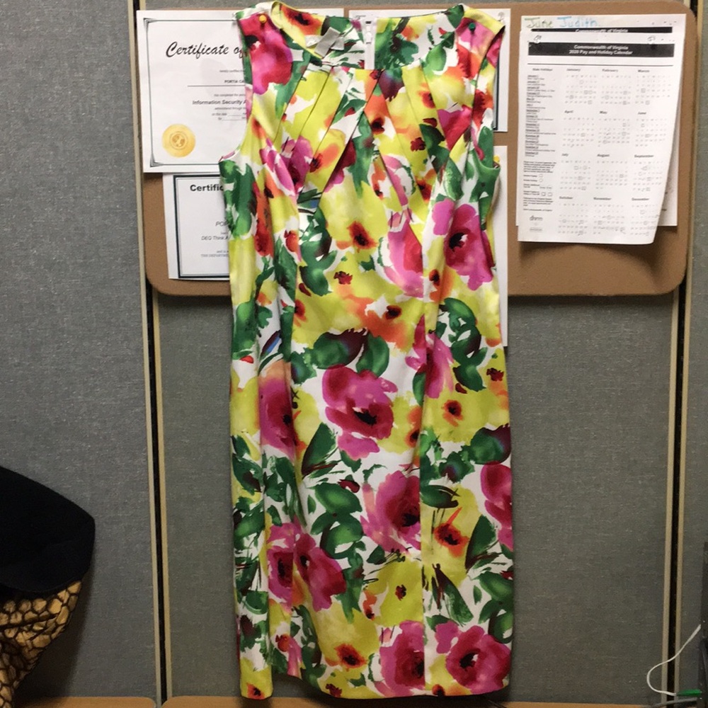 It’s orange size 8 complementary fitted dress